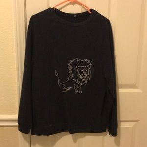 navy blue sweater with lion detail